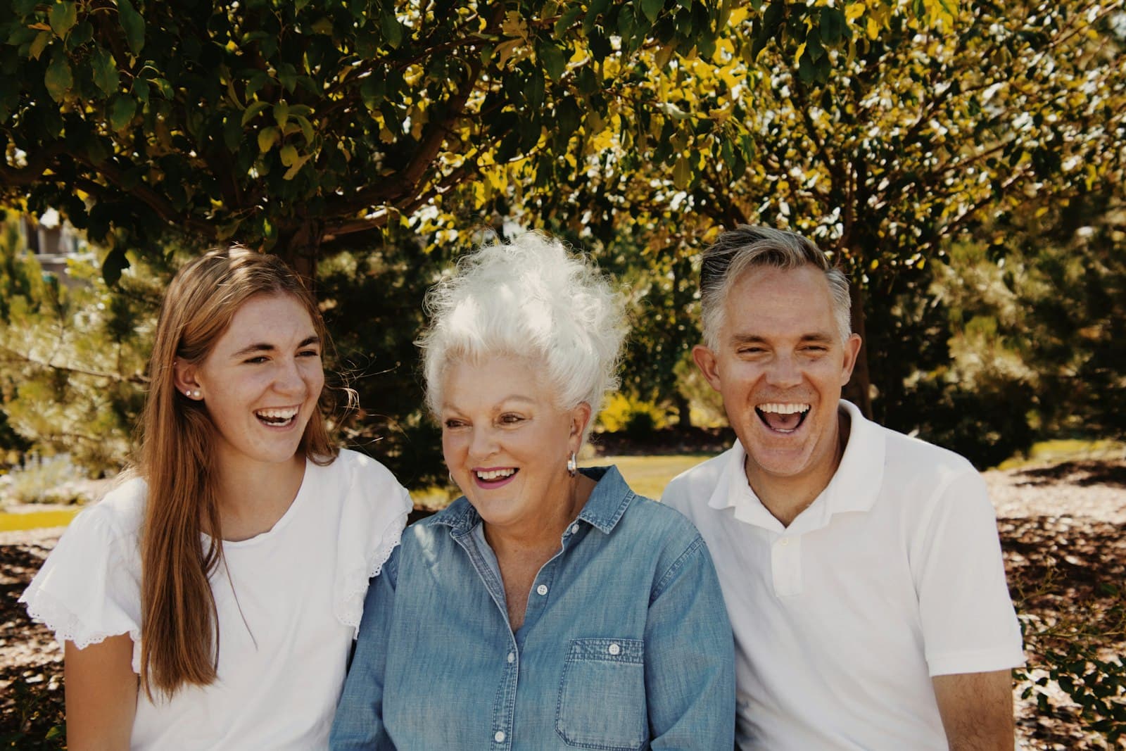 Three generations of a family smiling together — the people Peak Access serves